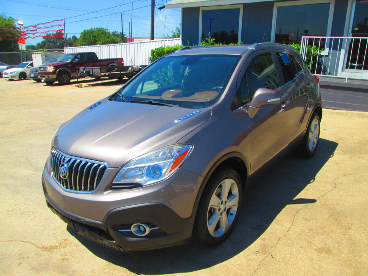 2015 GOLD Buick Encore Leather FWD (KL4CJCSB0FB) with an 1.4L L4 DOHC 16V TURBO engine, 6-Speed Automatic transmission, located at 1815 NE 28th St., Fort Worth, TX, 76106, (817) 625-6251, 32.795582, -97.333069 - Photo#0