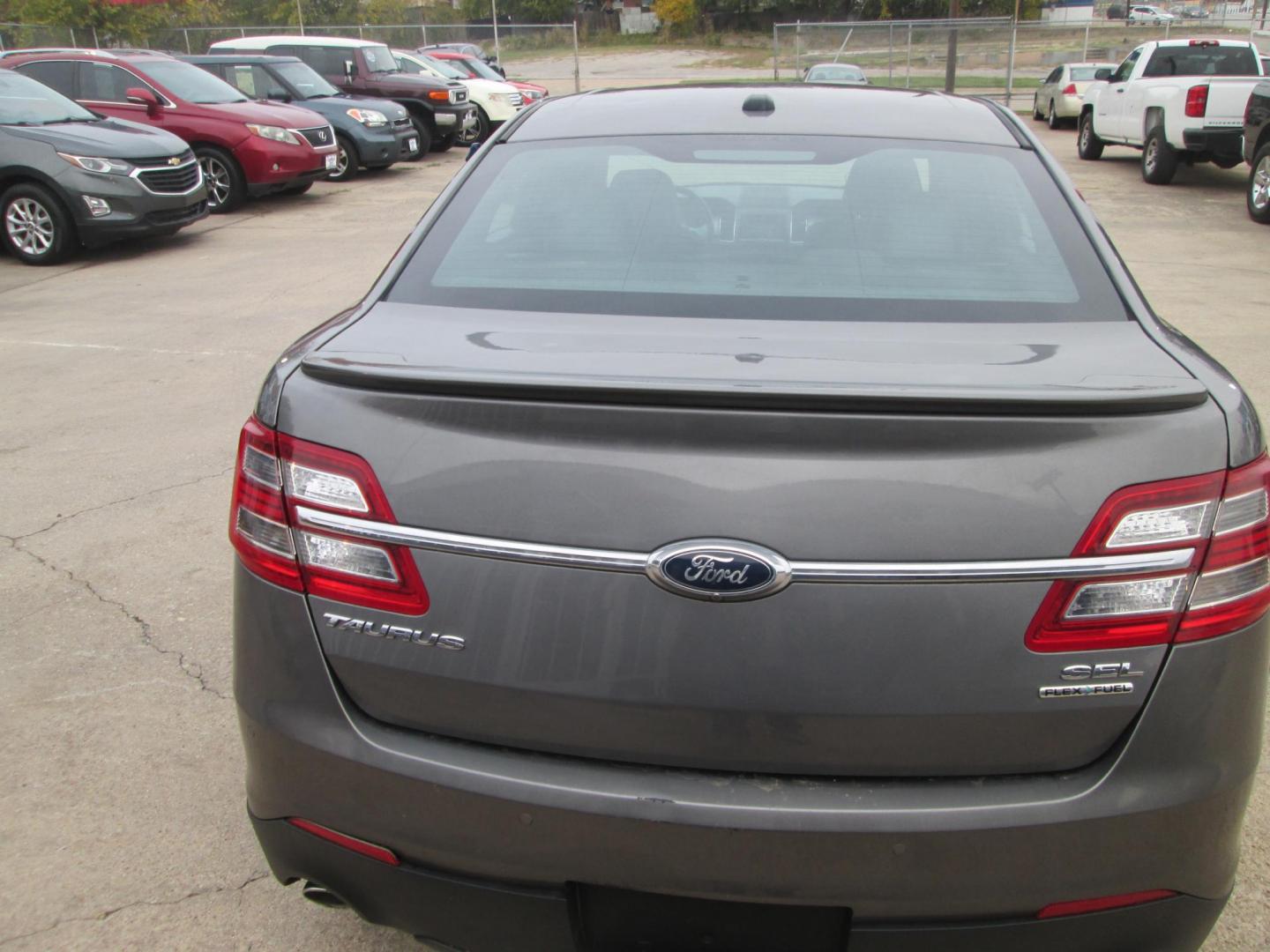 2014 GRAY Ford Taurus SEL FWD (1FAHP2E80EG) with an 3.5L V6 DOHC 24V engine, 6-Speed Automatic transmission, located at 1815 NE 28th St., Fort Worth, TX, 76106, (817) 625-6251, 32.795582, -97.333069 - Photo#5