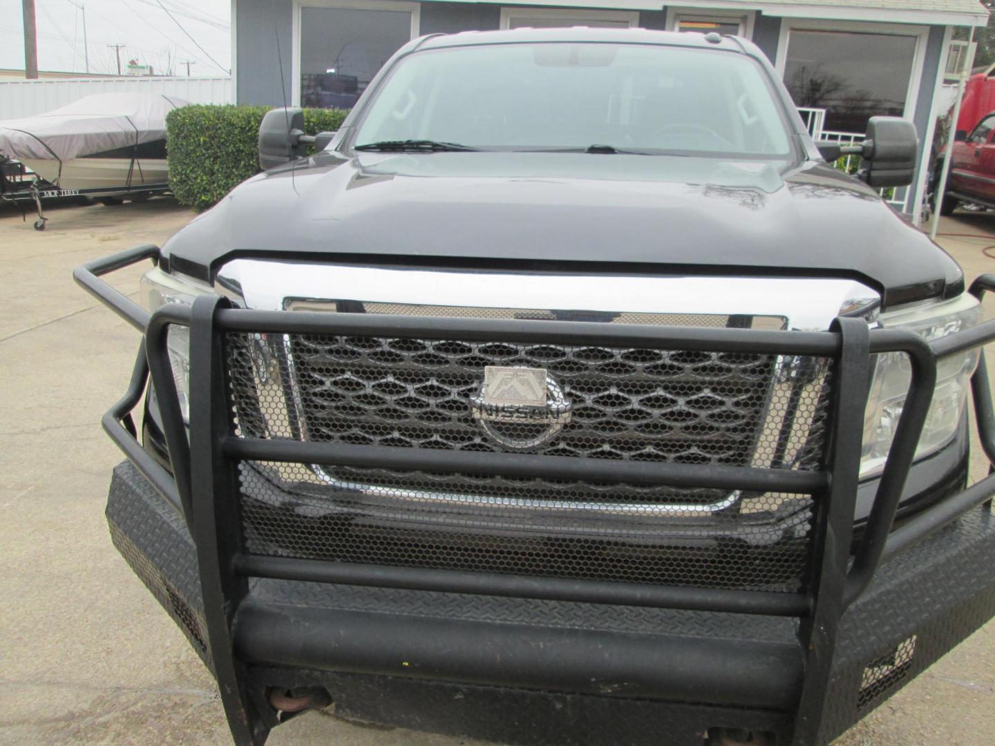 2017 BLACK Nissan Titan XD SV 4WD (1N6AA1F37HN) with an 5.6L V8 DOHC 32V engine, 6A transmission, located at 1815 NE 28th St., Fort Worth, TX, 76106, (817) 625-6251, 32.795582, -97.333069 - Photo#1