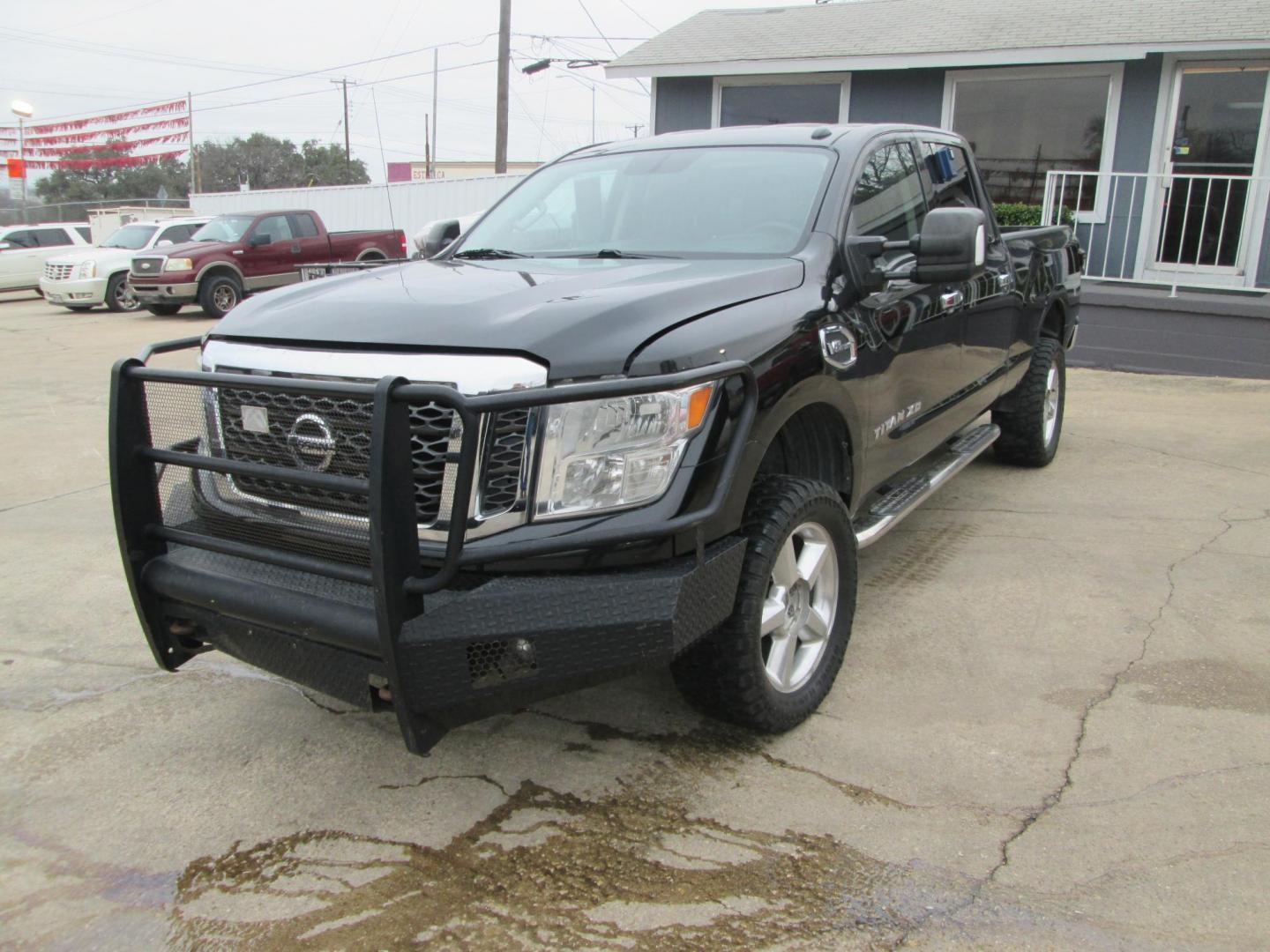 2017 BLACK Nissan Titan XD SV 4WD (1N6AA1F37HN) with an 5.6L V8 DOHC 32V engine, 6A transmission, located at 1815 NE 28th St., Fort Worth, TX, 76106, (817) 625-6251, 32.795582, -97.333069 - Photo#0