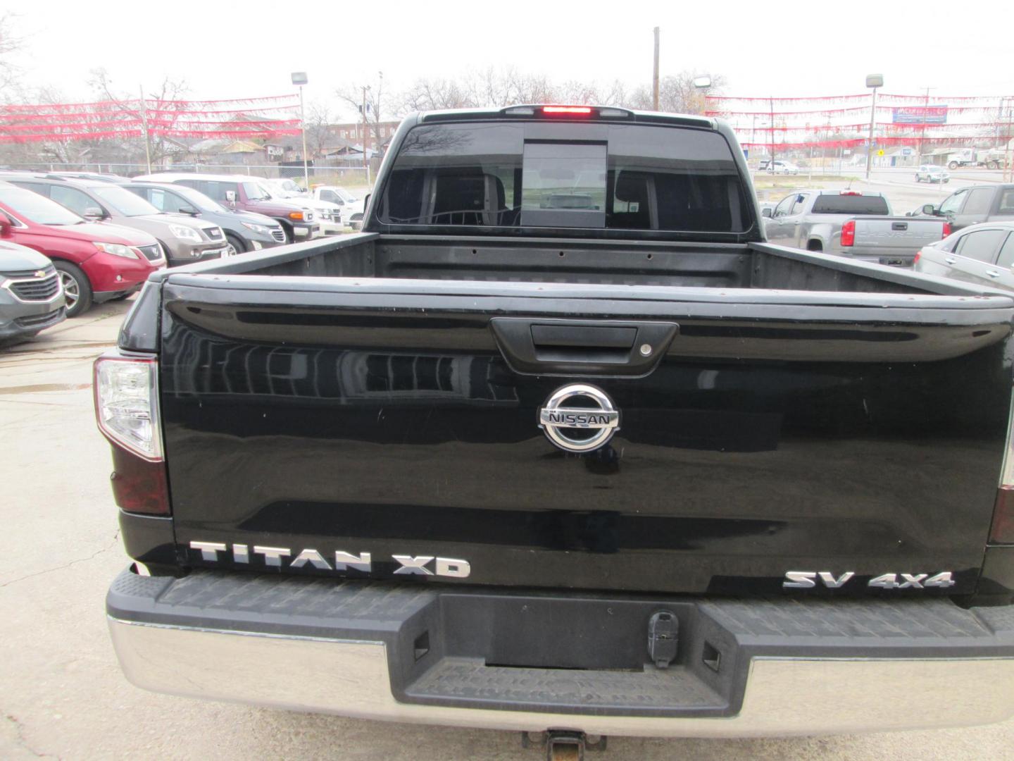 2017 BLACK Nissan Titan XD SV 4WD (1N6AA1F37HN) with an 5.6L V8 DOHC 32V engine, 6A transmission, located at 1815 NE 28th St., Fort Worth, TX, 76106, (817) 625-6251, 32.795582, -97.333069 - Photo#4